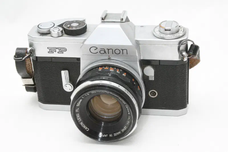 The picture shows a Canon FP Camera, this is a Single Lens Reflex Camera from the 60s