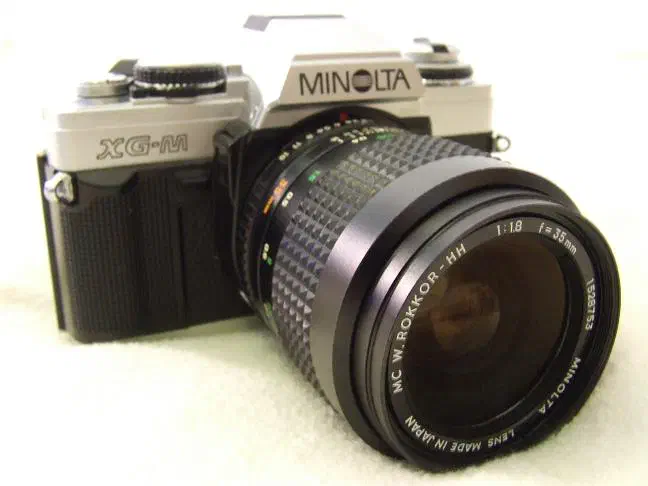 Minolta XG-M 35 mm film SLR camera with 35 mm f/1.8 lens