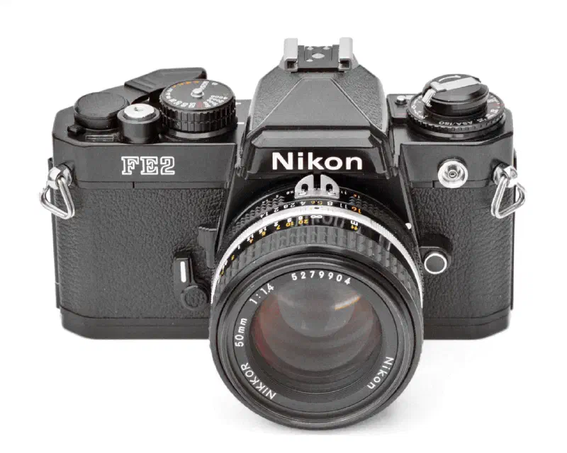 Nikon FE2 SLR camera (black), from front with Nikkor AI-S 50 mm f/1.4 lens