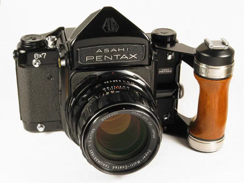 The Asahi Pentax 6×7 camera with plain finder prism, std. 105/2.4 lens and accessory grip