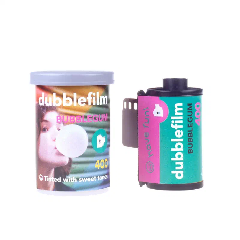 A dubblefilm Bubblegum 400 canister and 35 mm cassette on white, the canister showing someone blowing a bubble