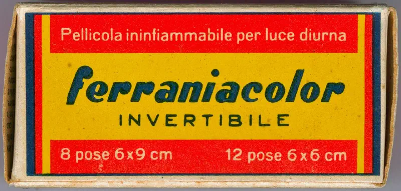 A red and yellow ferraniacolor INVERTIBILE carton, lettered in Italian and marked 8 pose 6x9 cm and 12 pose 6x6 cm