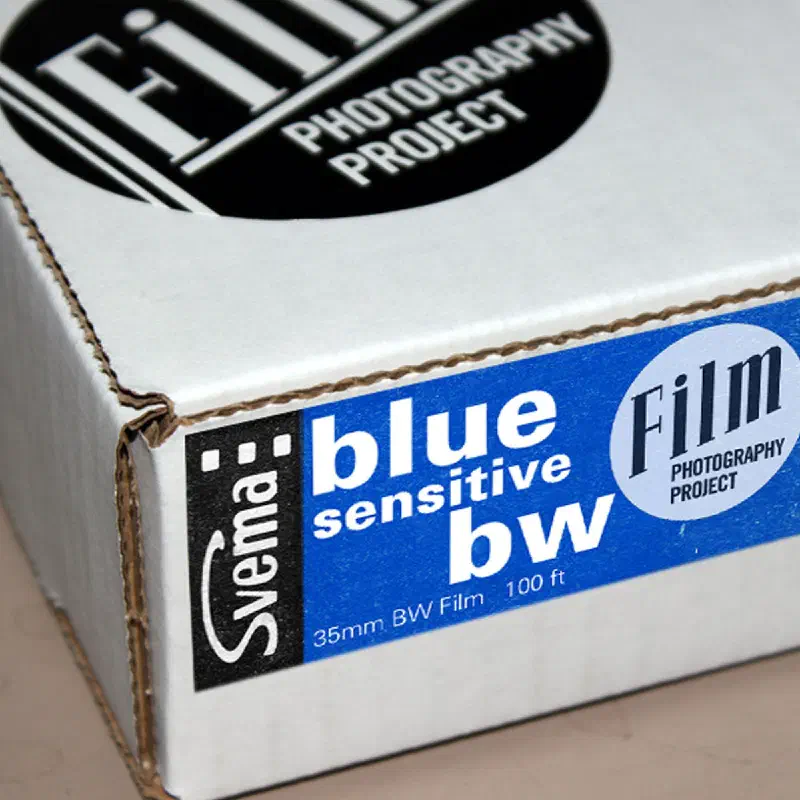 A white Film Photography Project box seen from a front corner, its blue label reading Svema blue sensitive bw, 35mm BW Film, 100 ft