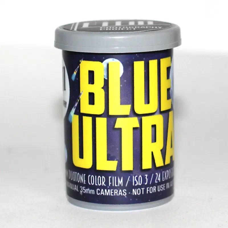 A grey-capped FPP canister labelled BLUE ULTRA in yellow over a starfield