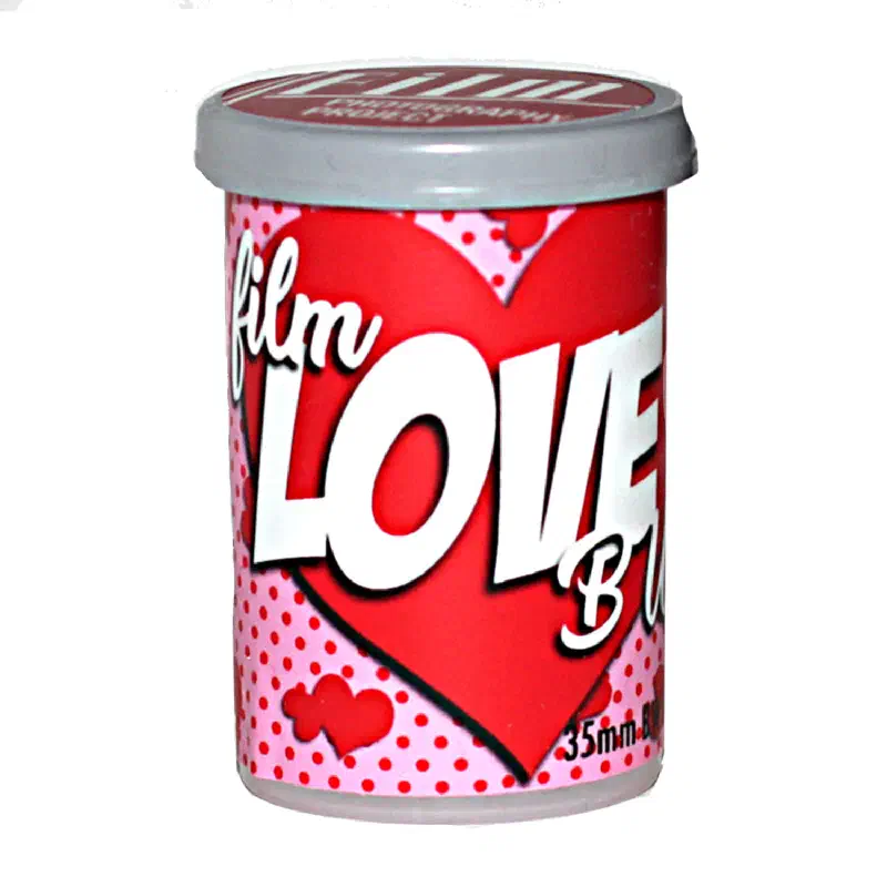 A red and pink FPP Film Love canister patterned with hearts