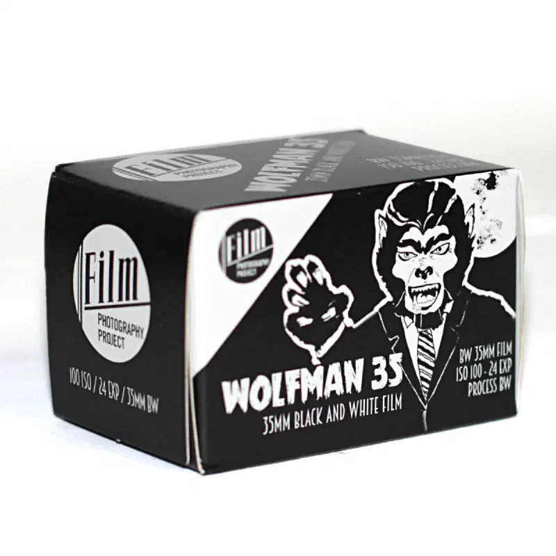 A black and white WOLFMAN 35 carton, a werewolf drawn twice across the front, marked 35MM BLACK AND WHITE FILM, ISO 100 / 24 EXP