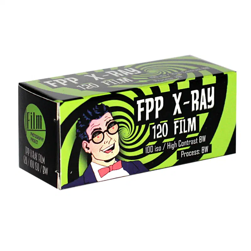 A lime green FPP X-RAY 120 FILM carton with a cartoon radiographer at its centre, marked 100 asa / High Contrast BW, Process: BW