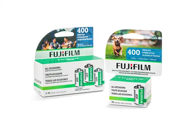 A FUJIFILM 400 three-pack in a green and white carton beside a single carton and two 35 mm cassettes, marked ALL OCCASIONS