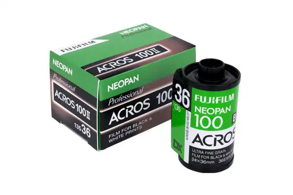 A box of Neopan 100 Acros II beside a 135 cassette of the film