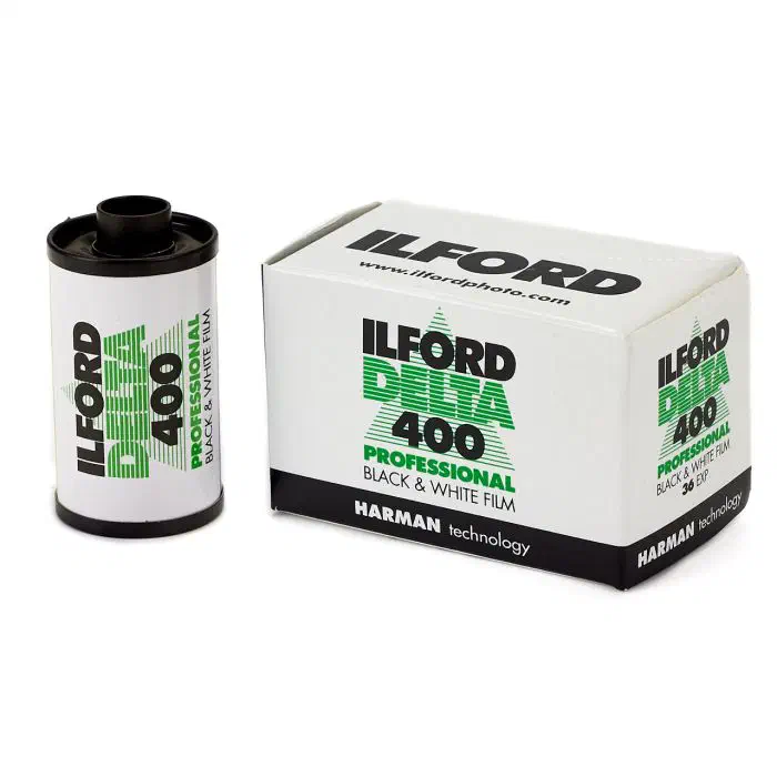 A 35 mm cassette of ILFORD DELTA 400 Professional beside its 36-exposure carton, lettered in green