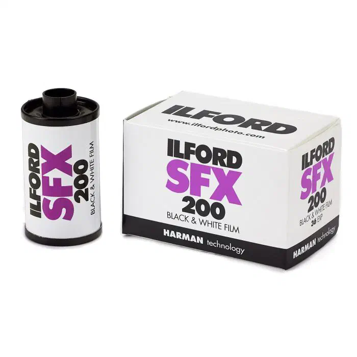 A 35 mm cassette of ILFORD SFX 200 beside its 36-exposure carton, lettered in magenta