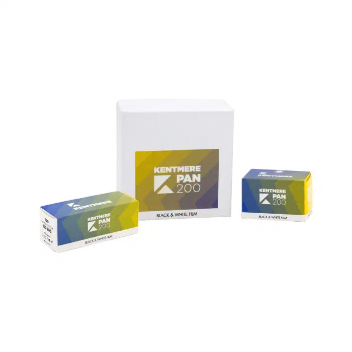 Three packages of KENTMERE PAN 200 in a blue-to-yellow gradient: two cartons and a larger plain white box carrying the same label