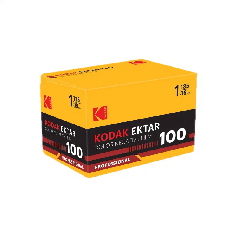 A yellow KODAK EKTAR 100 carton seen from a front corner, black band with a dark red stripe and a PROFESSIONAL flash, marked COLOR NEGATIVE FILM and 1 135/36 EXP