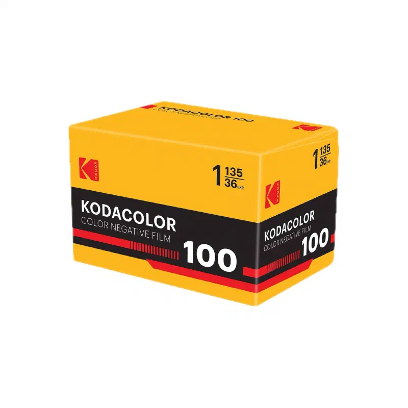 A yellow KODAK KODACOLOR 100 carton seen from a front corner, black band with a red stripe, marked COLOR NEGATIVE FILM and 1 135/36 EXP