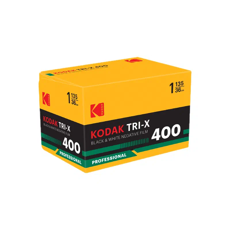 A yellow KODAK TRI-X 400 carton seen from a front corner, black band with a green stripe and a PROFESSIONAL flash, marked BLACK & WHITE NEGATIVE FILM and 1 135/36 EXP