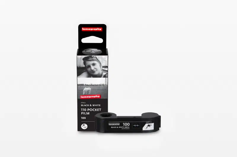 A black Orca Black & White 110 carton beside its 110 cartridge, marked 110 POCKET FILM 100