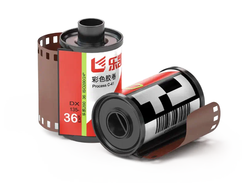 Two 35 mm cassettes of Lucky Color 200, one upright and one on its side, red and white labels reading 彩色胶卷 and Process C-41, marked DX 135-36 EXP