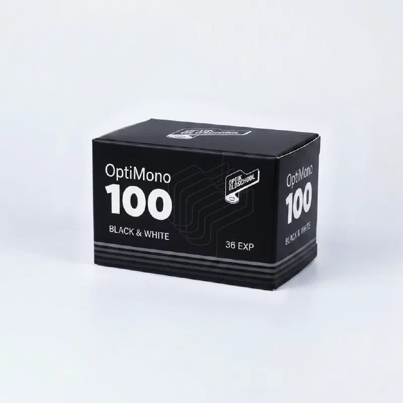 A black box of Optik Oldschool OptiMono 100 black and white film, 36 exposures