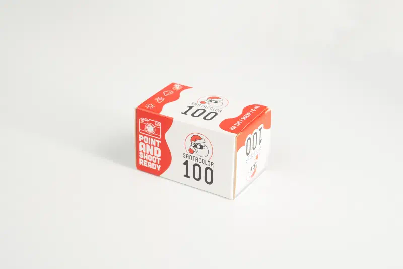 A red and white box of SantaColor 100 on a white ground