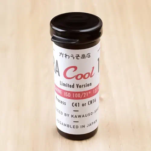 A 127 roll of Rera Cool 100 standing upright, its label facing the camera