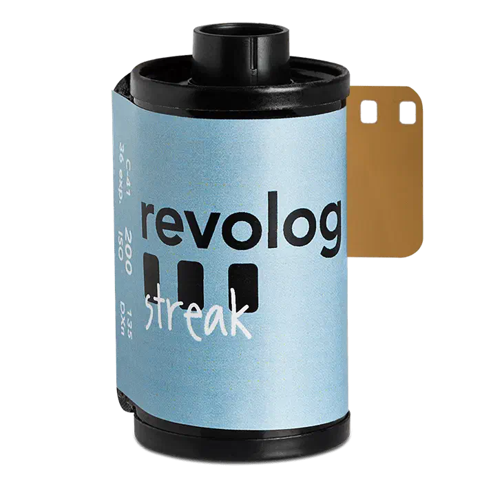 A 35 mm cassette of REVOLOG STREAK, its light blue label carrying the revolog wordmark