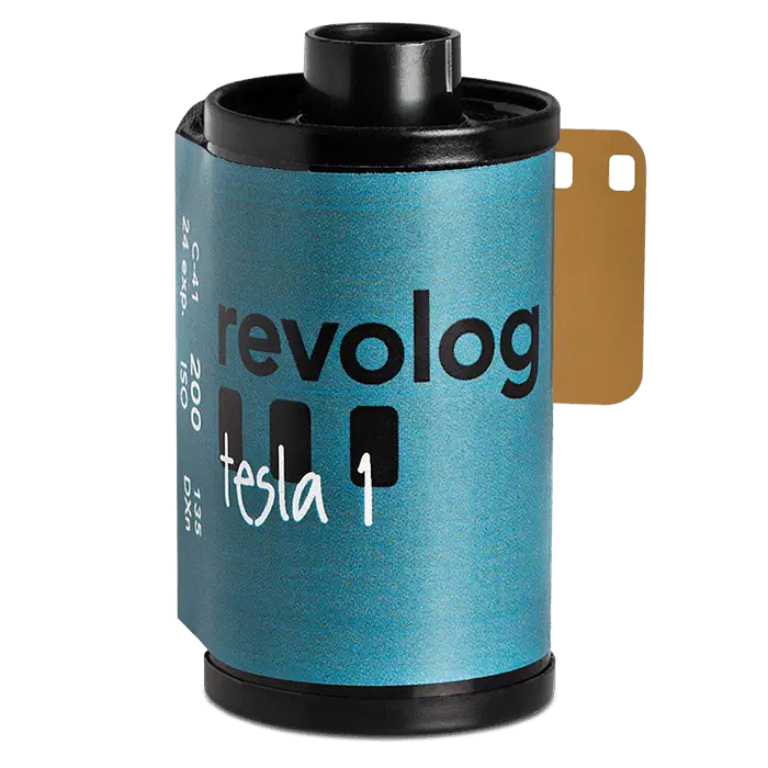 A 35 mm cassette of REVOLOG TESLA-I, its teal-blue label carrying the revolog wordmark