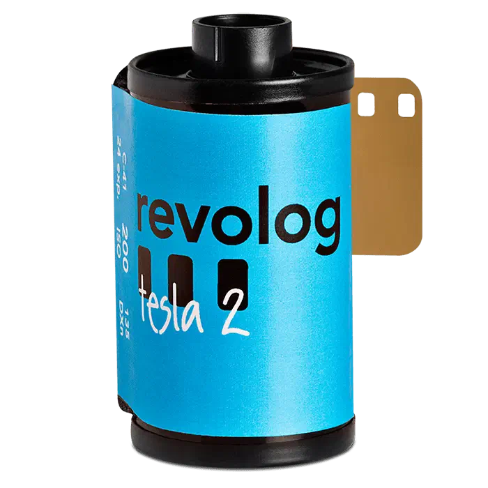 A 35 mm cassette of REVOLOG TESLA-II, its bright blue label carrying the revolog wordmark