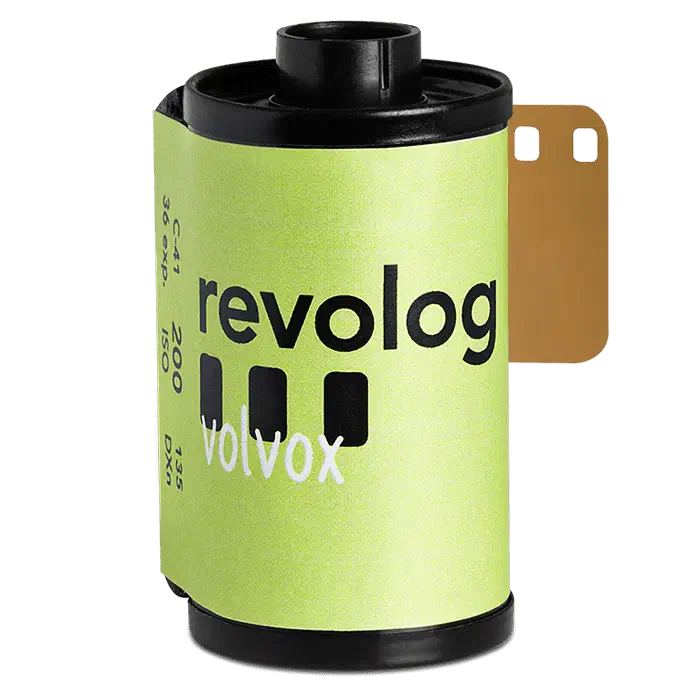 A 35 mm cassette of REVOLOG VOLVOX, its yellow-green label carrying the revolog wordmark