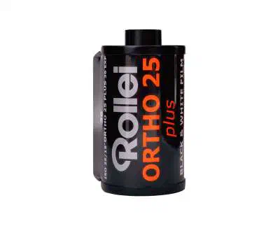A 35 mm cassette of Rollei ORTHO 25 plus, black label lettered in orange and white, marked BLACK & WHITE FILM