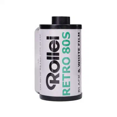 A 35 mm cassette of Rollei RETRO 80S, white label lettered in green and black, marked BLACK & WHITE FILM