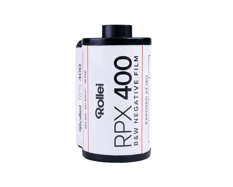 A 35 mm cassette of Rollei RPX 400, white label lettered in black and ruled with fine red lines, marked B&W NEGATIVE FILM and EXPOSED AT ISO