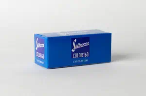 A blue carton of Silberra Color 160 C-41 colour negative film in 120 format