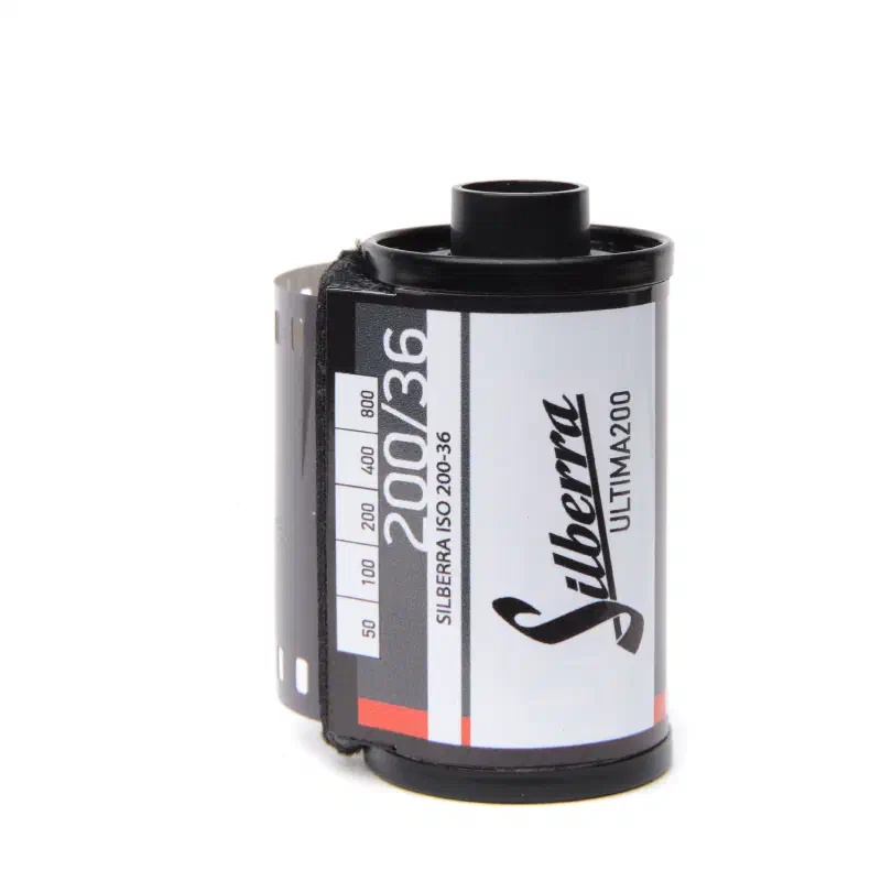 A 35 mm cassette of Silberra Ultima 200 black-and-white film, marked 200/36