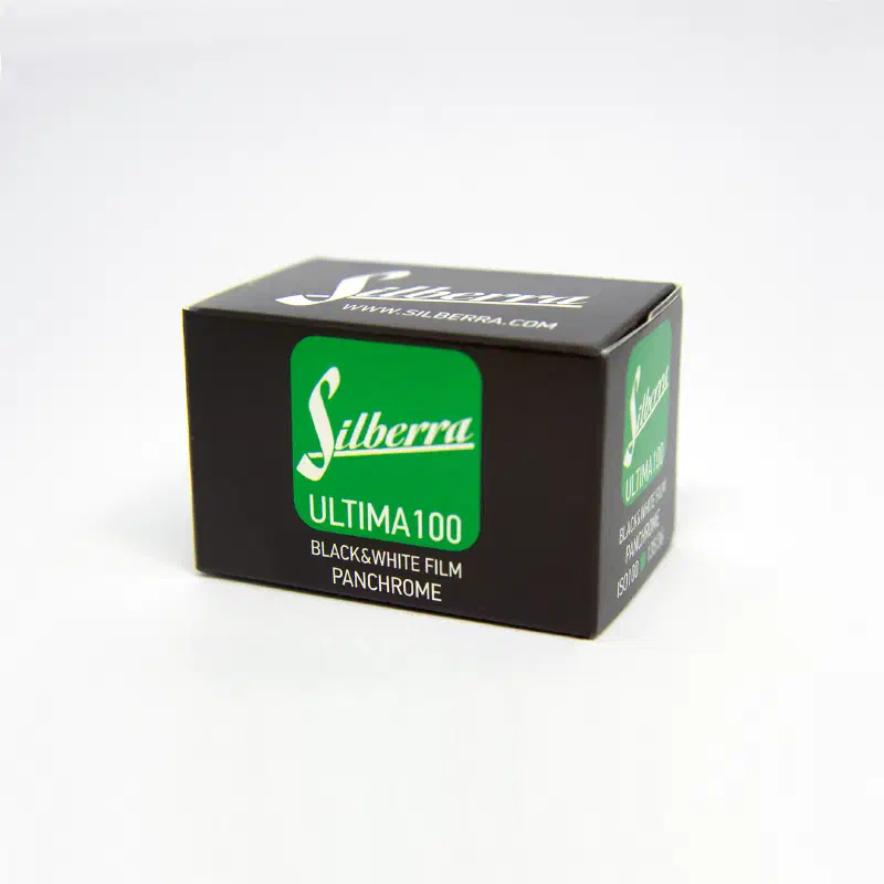 A black carton of Silberra Ultima 100 panchromatic black-and-white film with a green panel
