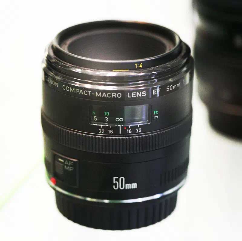 Canon New Macro FD 50mm f/3.5, photographed on its own, off the camera