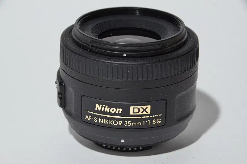 Nikon Nikkor 35mm f/1.8G AF-S DX, photographed on its own, off the camera