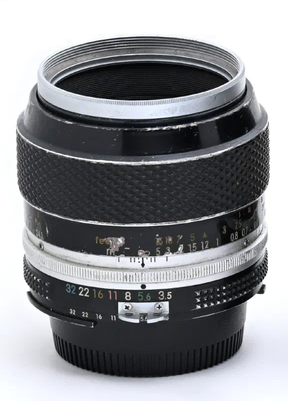 Nikon Nikkor 55mm f/3.5, photographed on its own, off the camera
