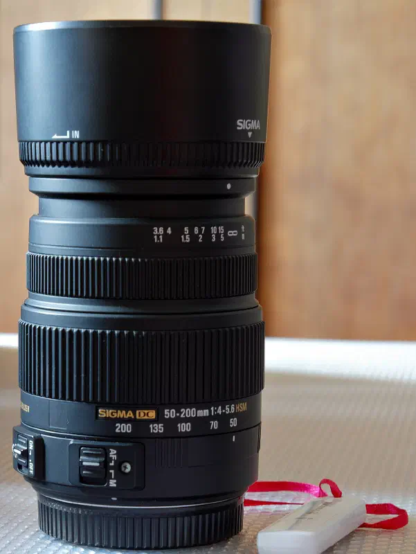 Sigma 50–200mm f4-5.6 DC O S HSM, photographed on its own, off the camera